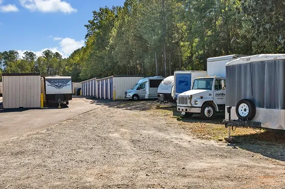 Outdoor vehicle and RV storage area with trailers and accessible storage units
